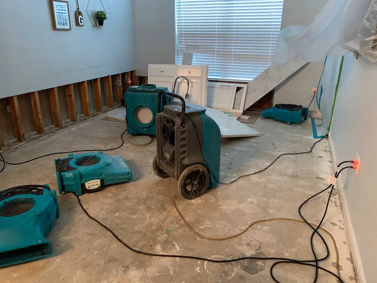 Dehumidifier in flood-cut room for Water Damage Restoration in Carl Junction